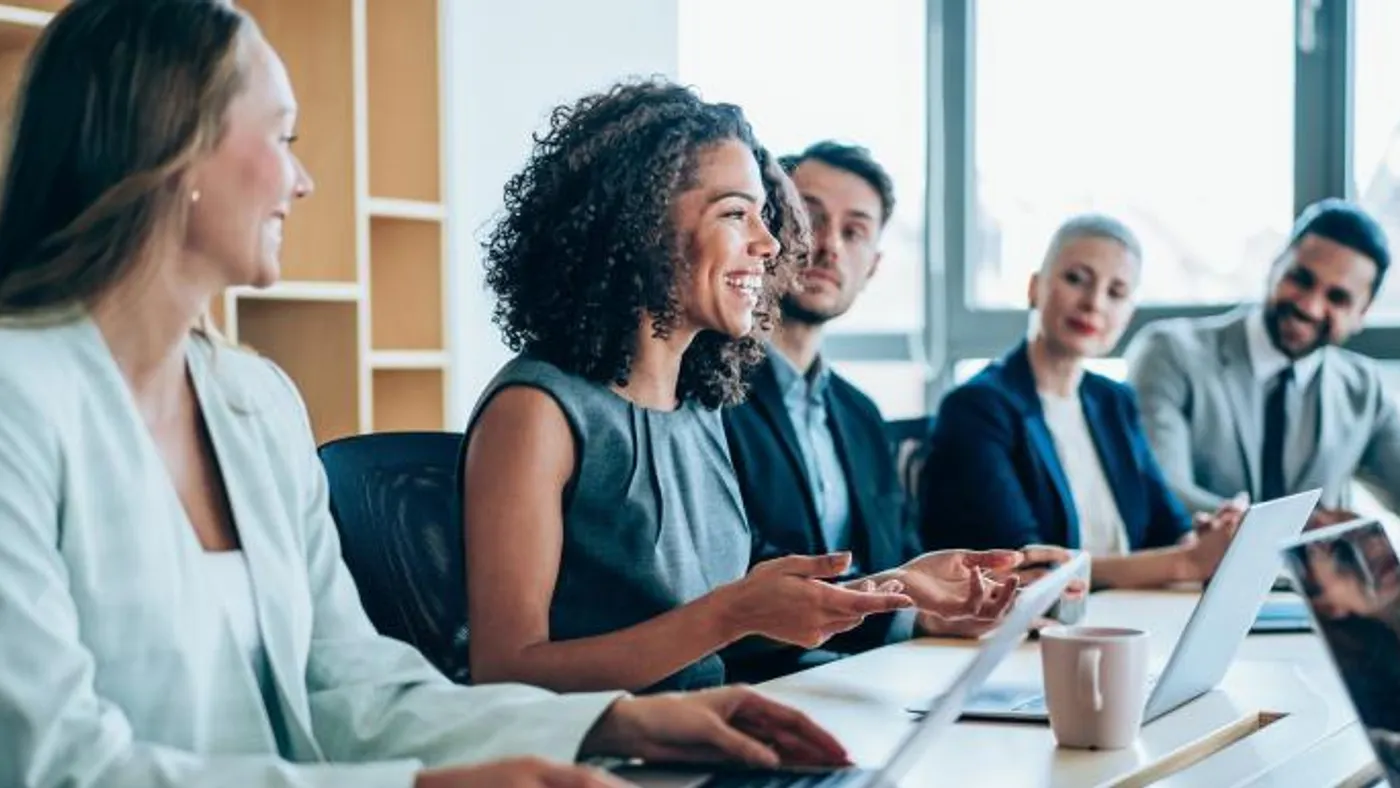Team members collaborating in a meeting