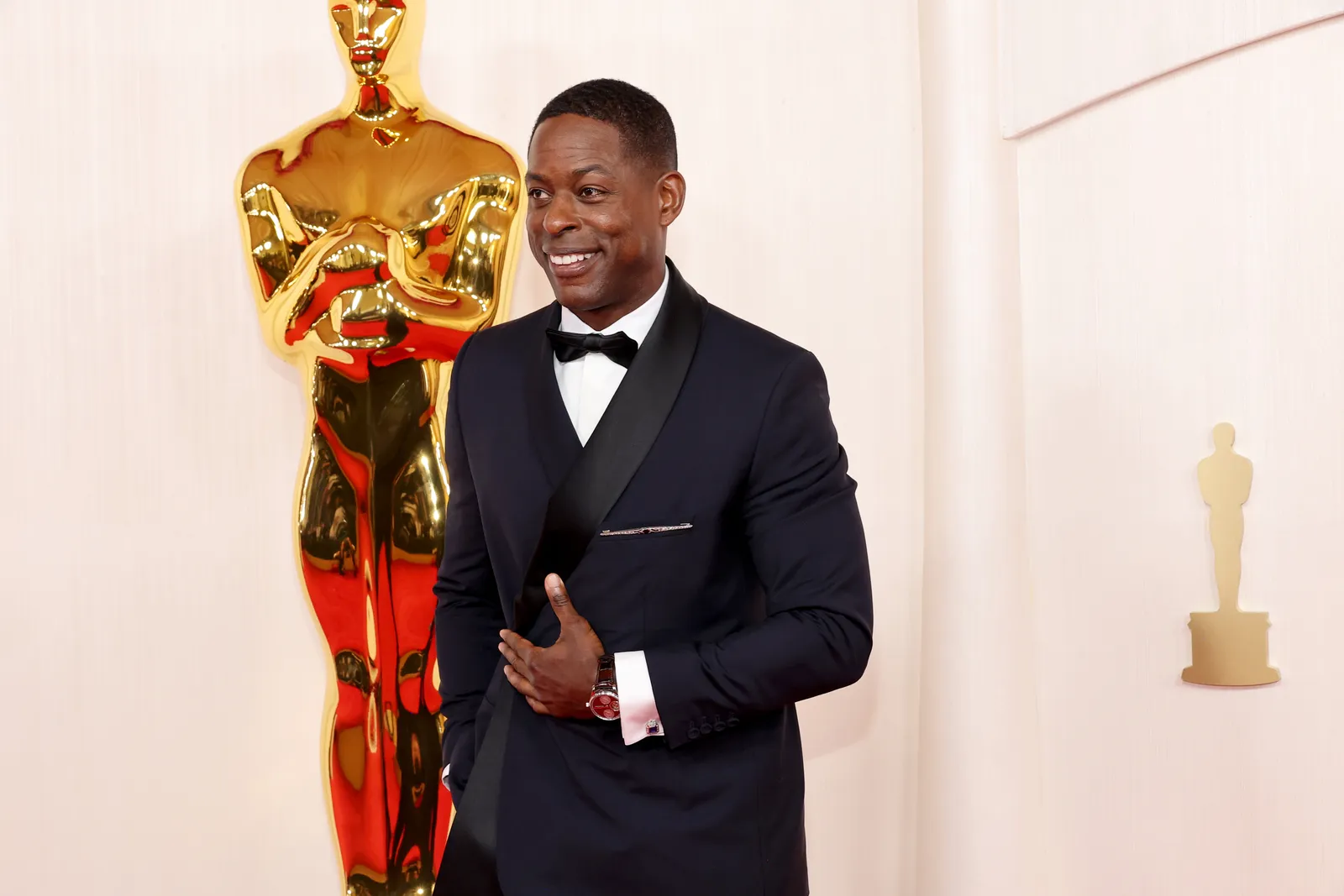 Sterling K. Brown wears a dark navy tuxedo.