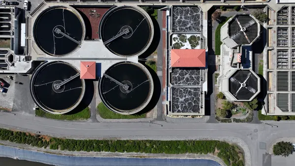 Pools of water are visible from above at a wastewater treatment plant