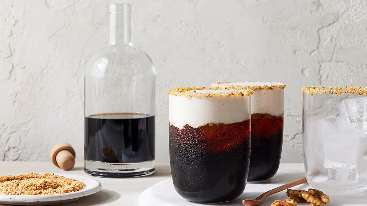 Walnuts crushed on glasses with a drink