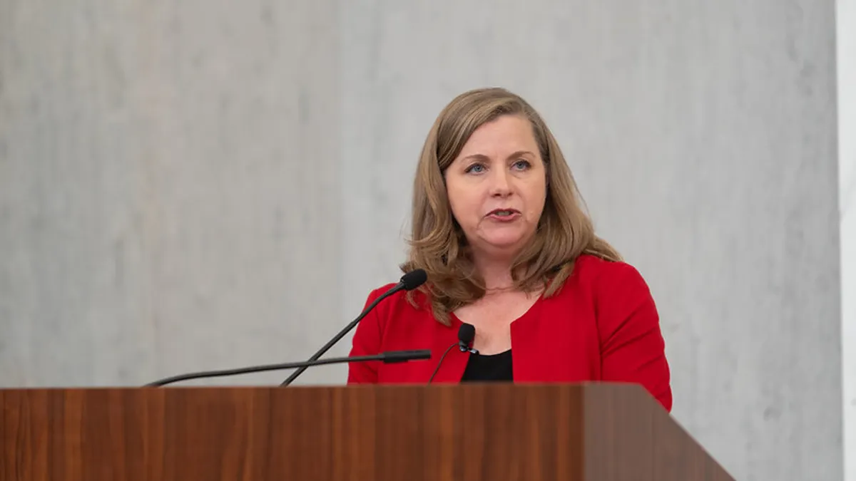 Federal Reserve Governor Michelle Bowman stands behind a podium and speaks.