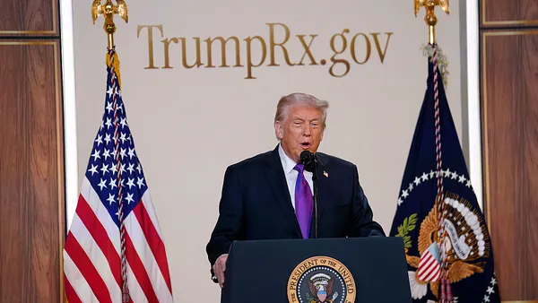 A photo of President Trump in front of a TrumpRx sign