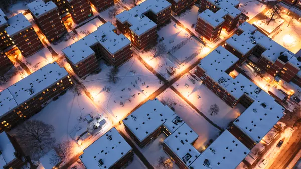 Aerial shot of buildings covered with snow