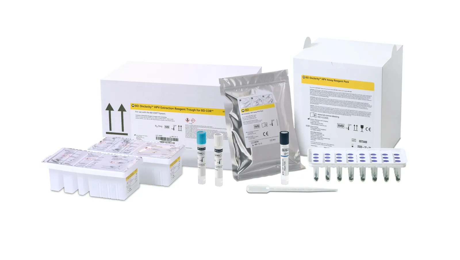 Two boxes are labeled as extraction reagent troughs and assay reagent packs, along with three test tubes and a pipette.