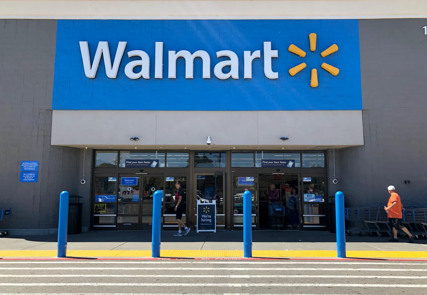 Customers enter a Walmart store in San Leandro, California.