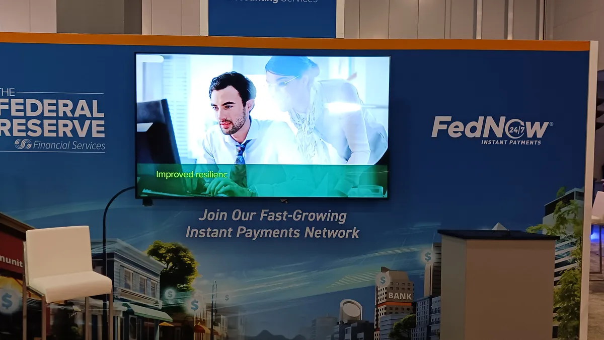 Booth and sign for Federal Reserve payments services at Nacha conference in May 2024.