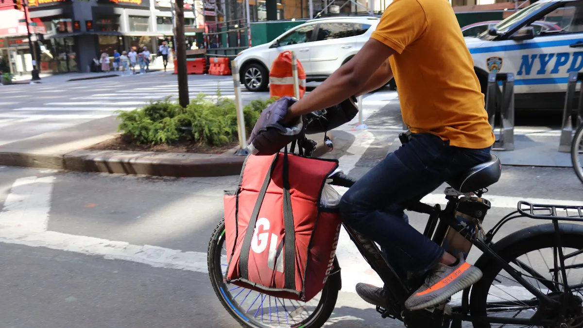 A Grubhub courier. Grubhub and Sonesta will offer delivery to 120 extended stay hotels.