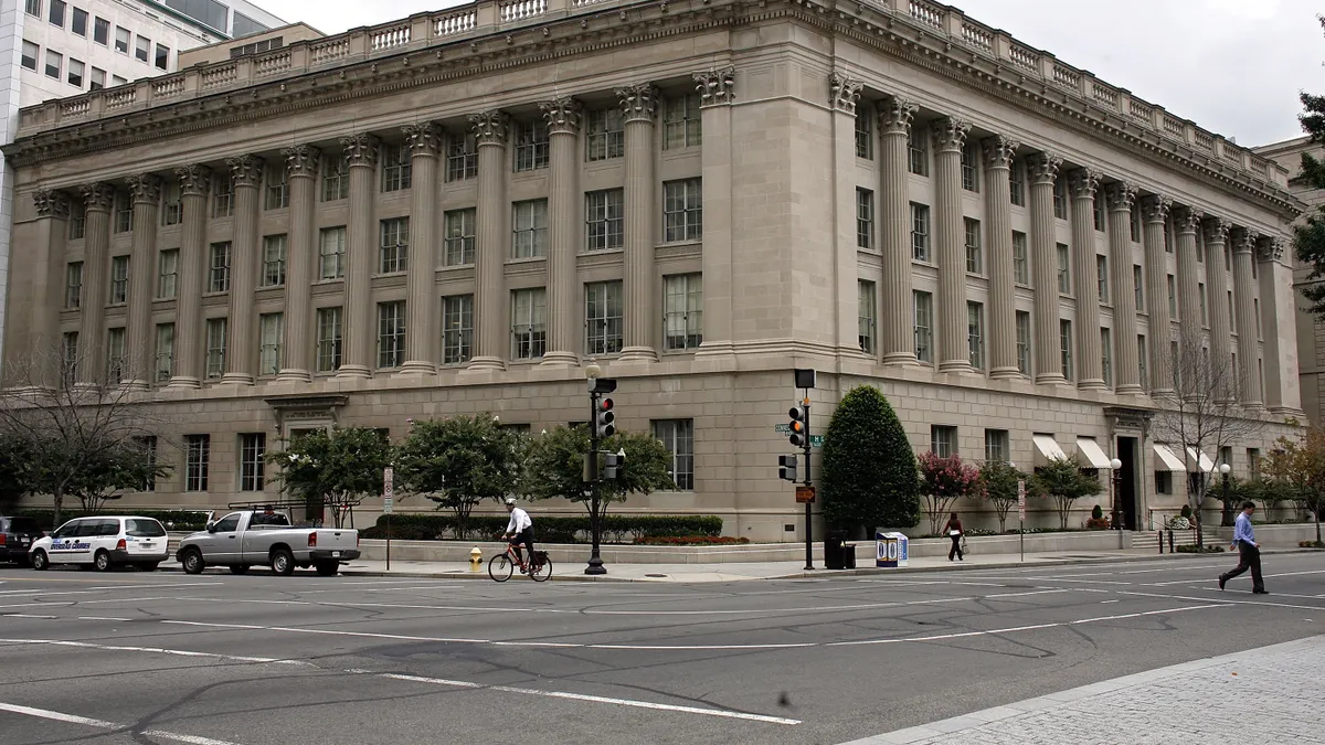 Pedestrians are seen in front of the U.S. Chamber of Commerce Building in downtown Washington, D.C.