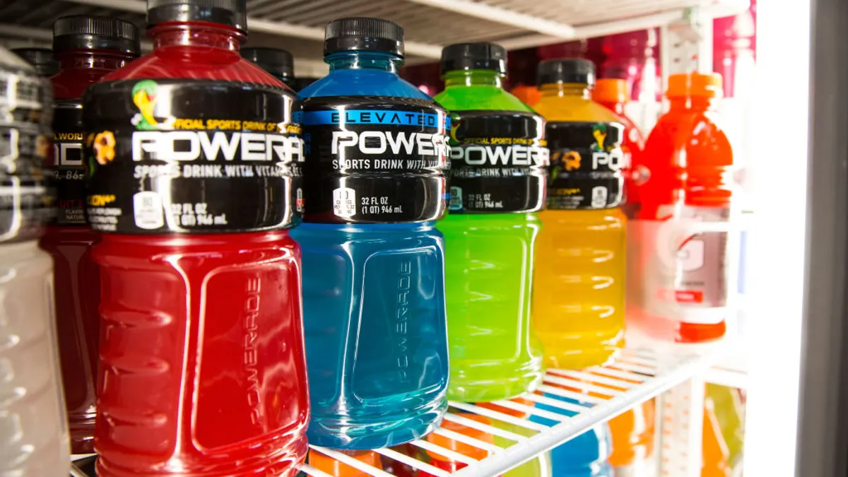Various flavors of Powerade sports drink sit on a shelf