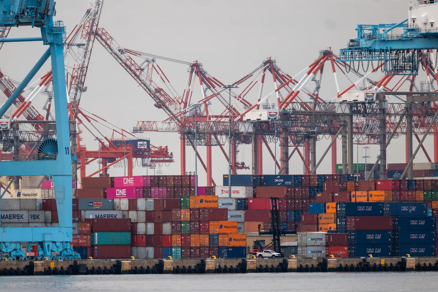 Cranes stand over shipping containers at the Port of Newark.