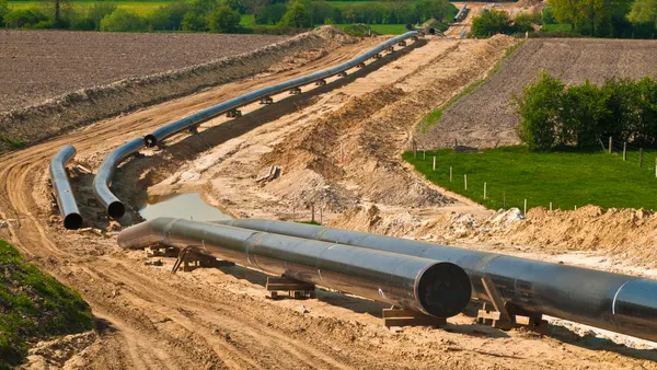 Construction of a gas pipeline through fields.