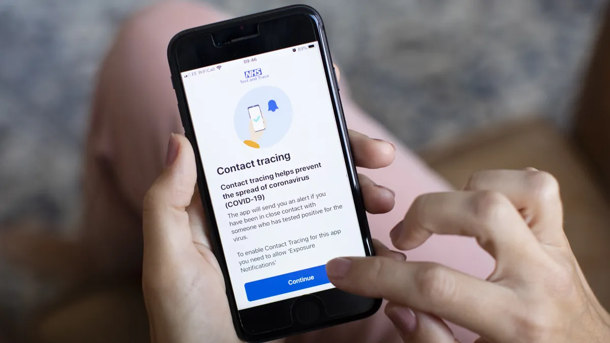 A person using the UK government's Covid tracing app