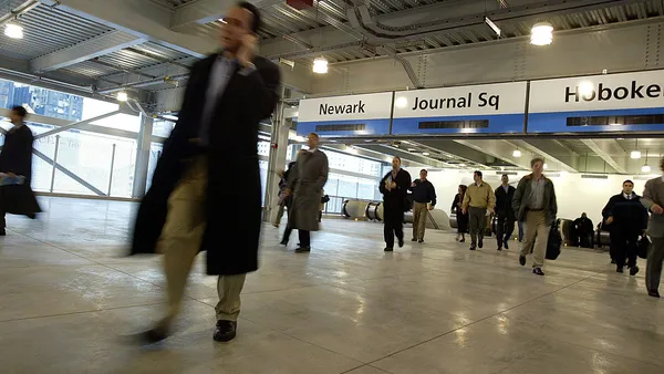 Passengers arrive at the Port Authority Transportation Hudson subway train station.