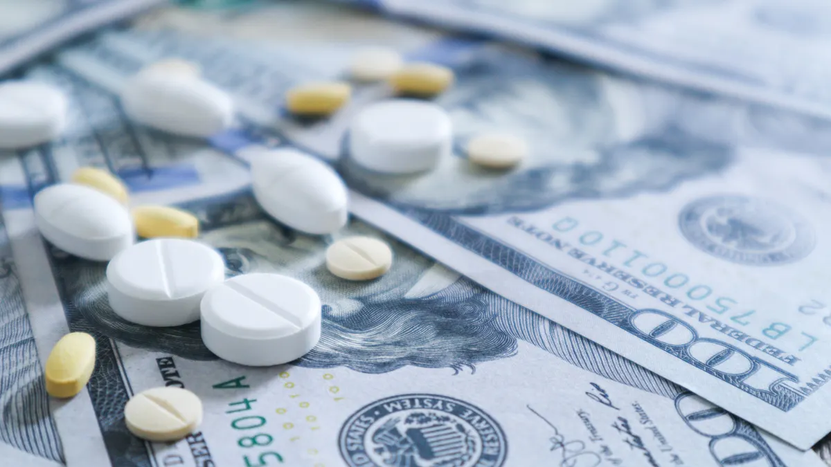 Medicine pill on 100 dollar banknote background