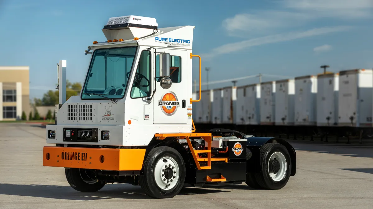 An Orange EV terminal truck.