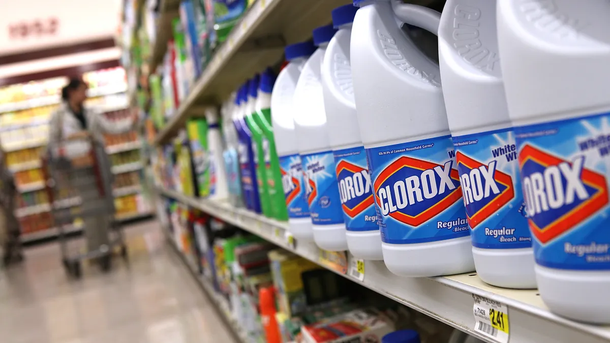 Bottles of Clorox bleach on a supermarket shelf.