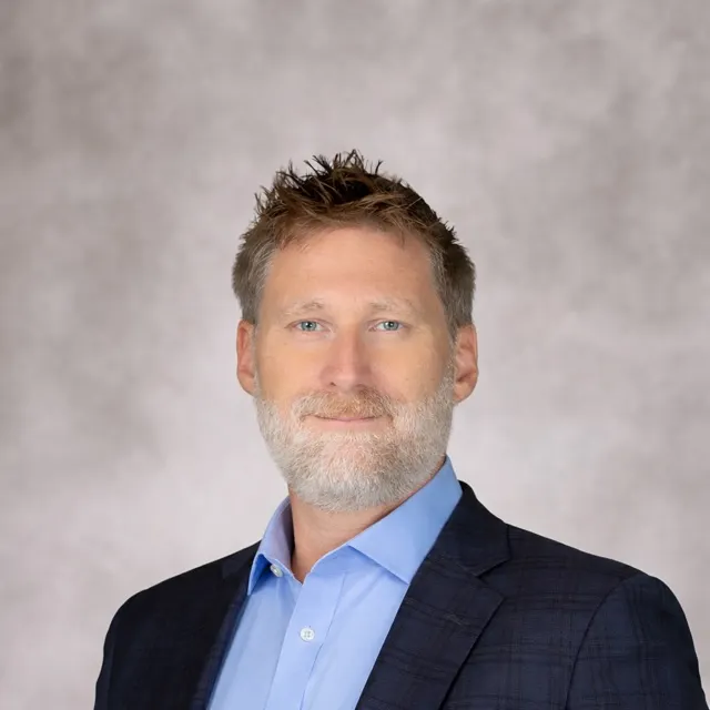 A headshot of Christian Greyenbuhl.