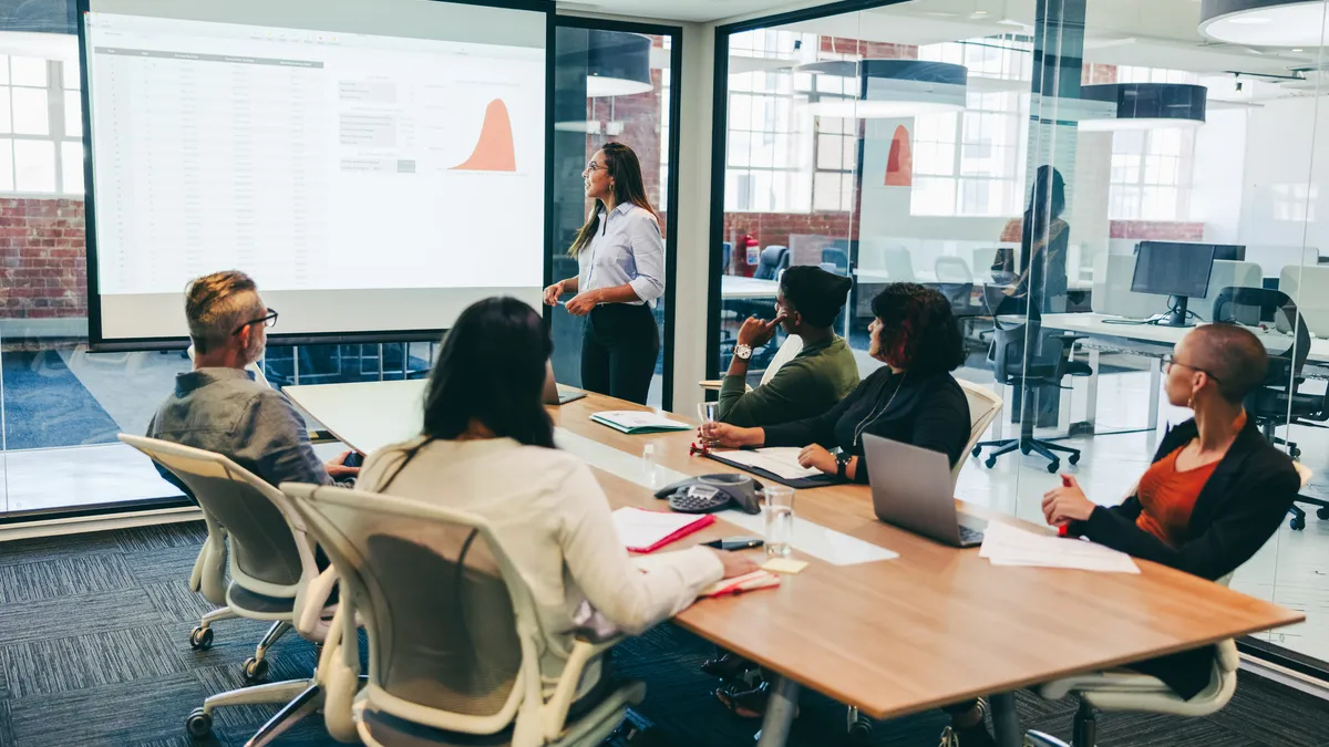 A business meeting being held in a company boardroom.