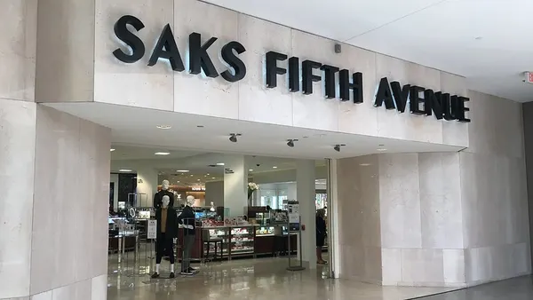 A mall entrance to a department store, Saks Fifth Avenue.