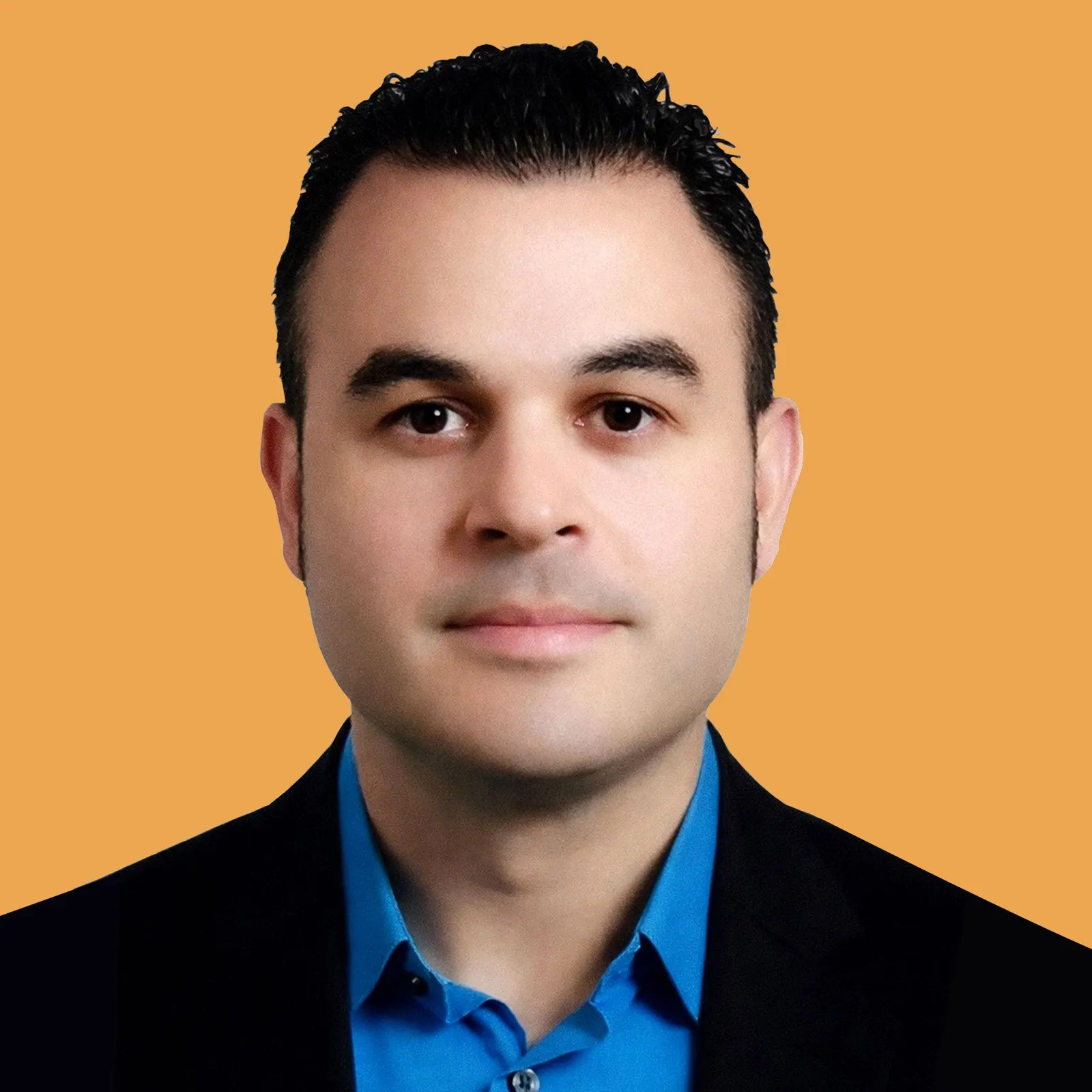 Headshot of a man against a bright orange backdrop