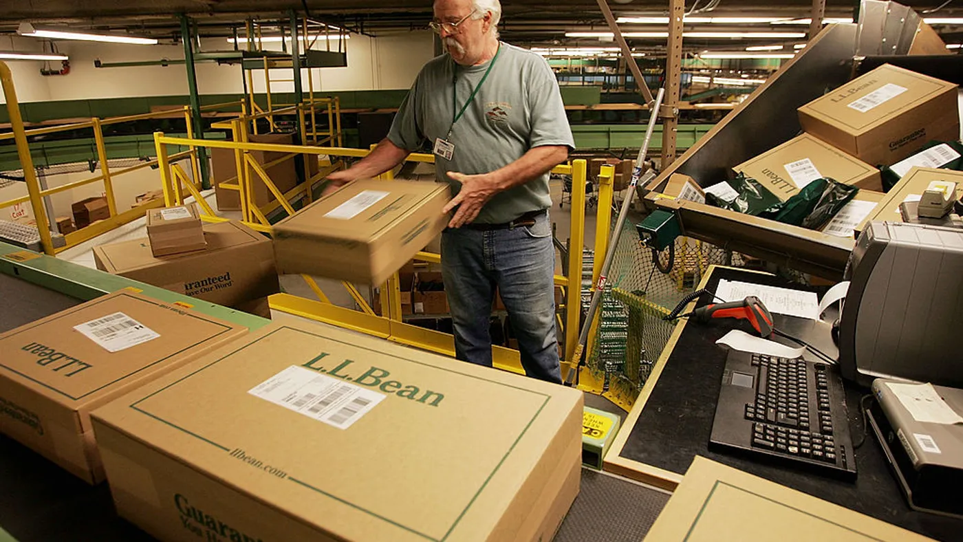 A worker sorts boxed orders in the L.L. Bean shipping center on Nov. 28, 2005 in Freeport, Maine.