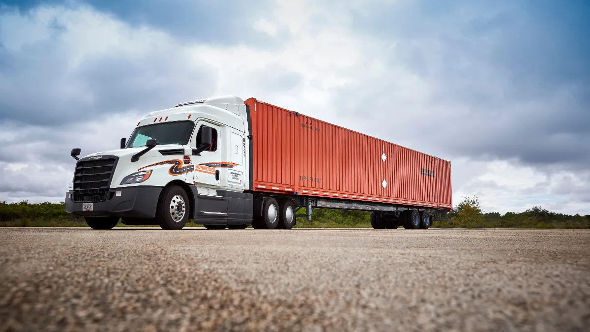 A Schneider intermodal truck parked in a lot.