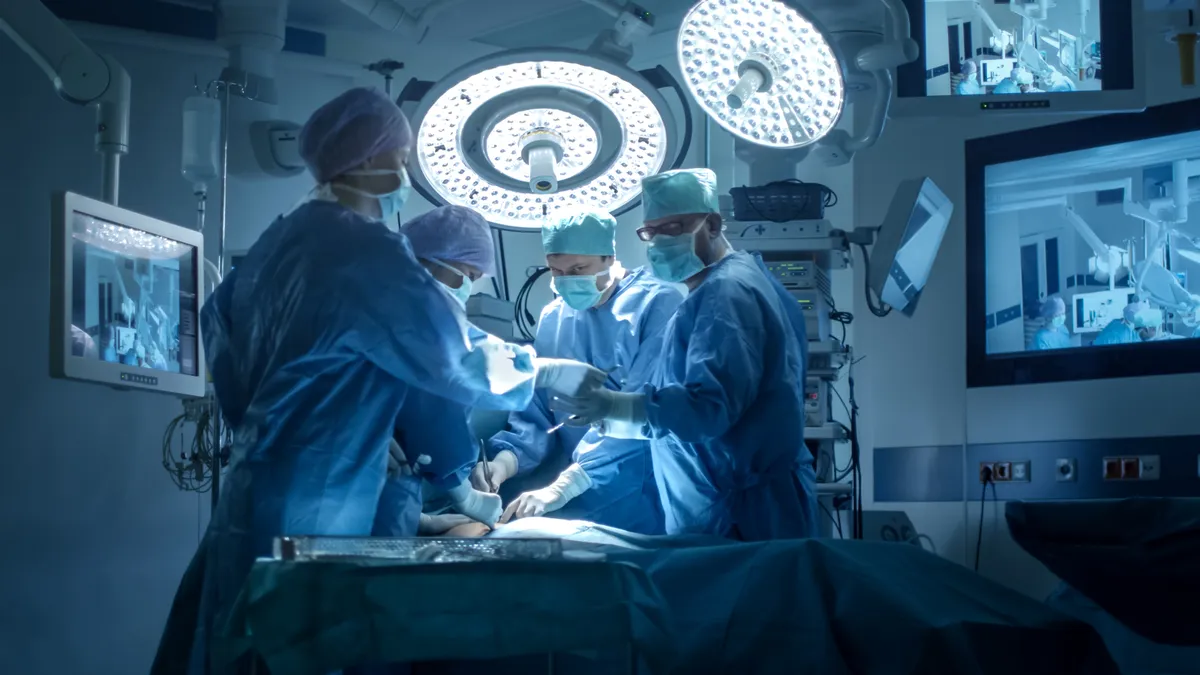 Surgeons and healthcare workers in an operating room