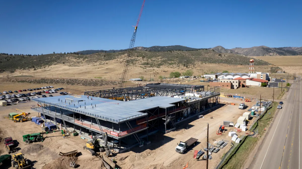 An aerial view of a crane over a construction jobsite.