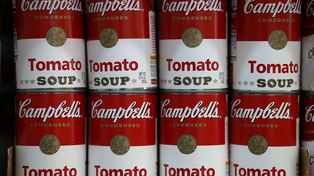 MAY 20: Cans of Campbell's tomato soup are displayed on a shelf at Santa Venetia Market on May 20, 2013 in San Rafael, California.