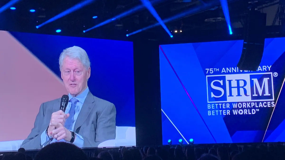 President Bill Clinton speaks to attendees at SHRM 2023 at the Las Vegas Convention Center.