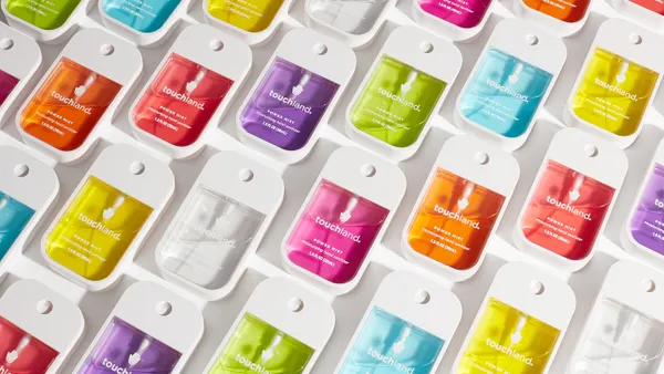 Touchland hand sanitizers in various colors laid out in rows