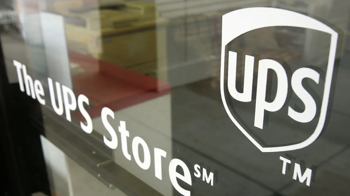 A UPS Store sign is seen on a door November 19, 2004 in Glenview, Illinois.