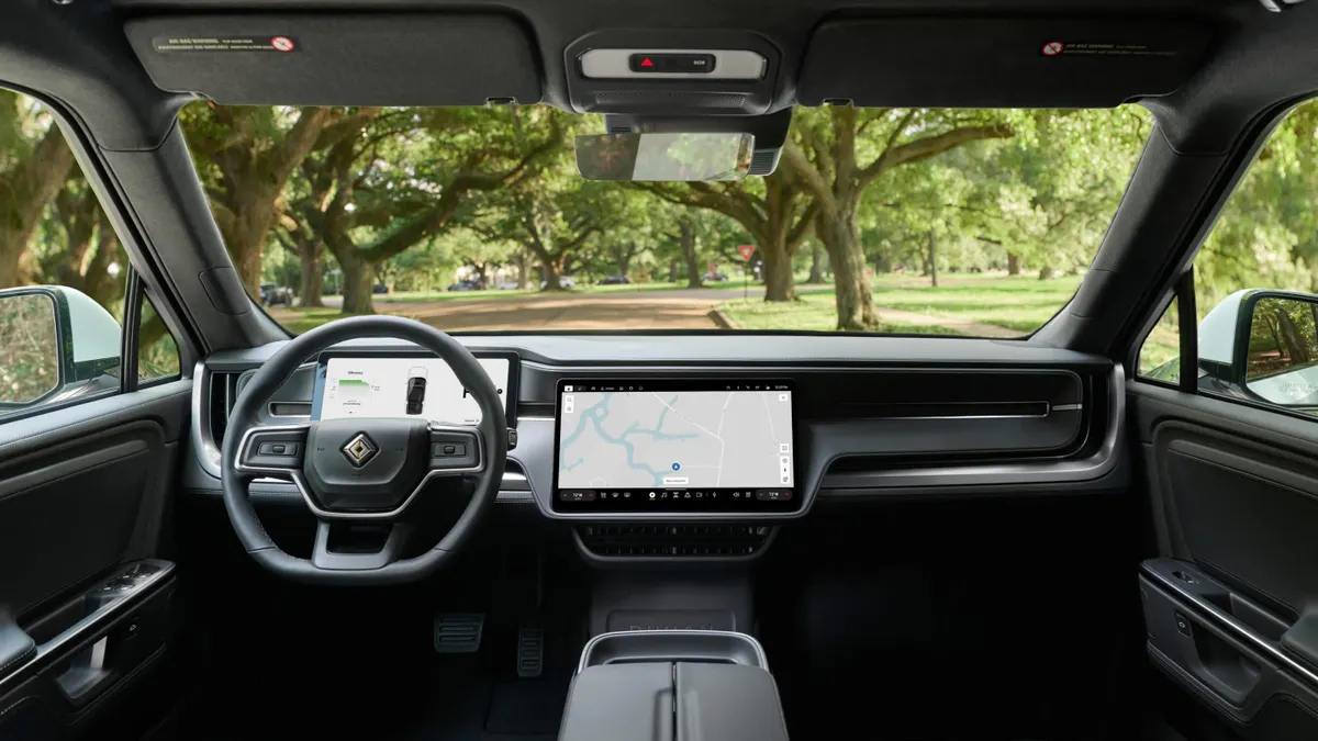 The interior of the Rivian RT1 showing the dashboard and steering wheel.