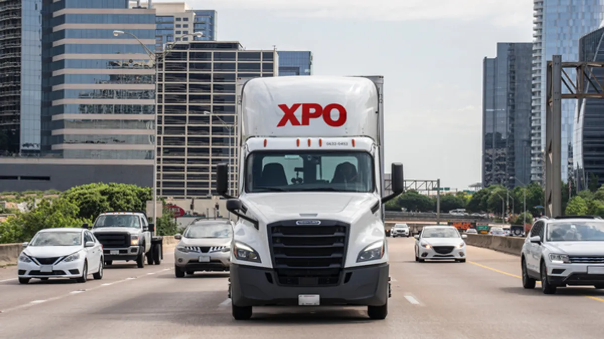 An XPO truck drives in Dallas.