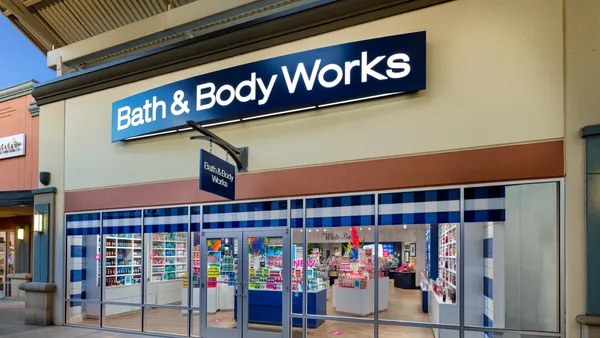 The exterior of a store with a banner that reads "Bath & Body Works."