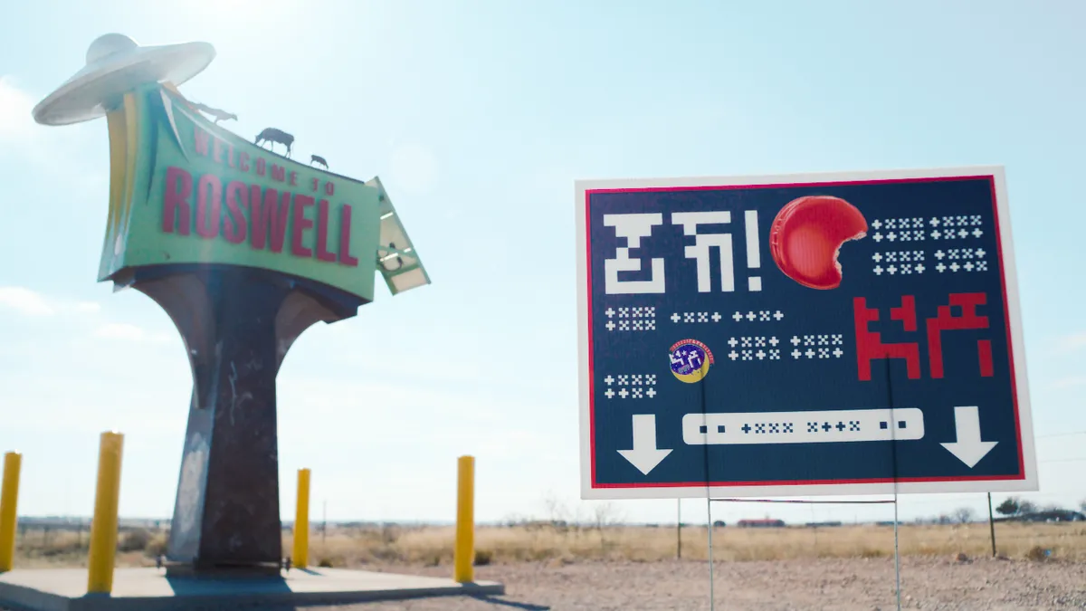 a MoonPie OOH advertisement near a sign for Roswell, NM