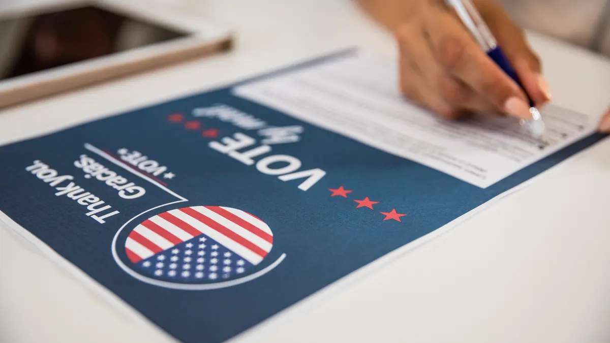 Young woman voting from home