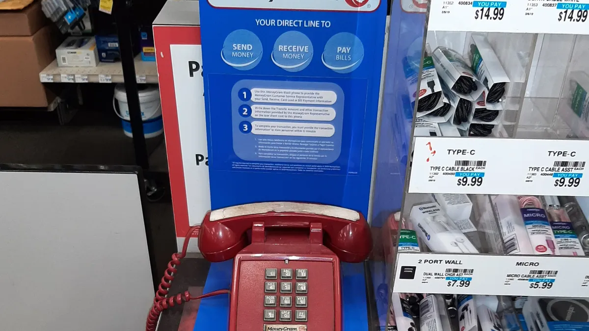 MoneyGram phone sits on store counter.