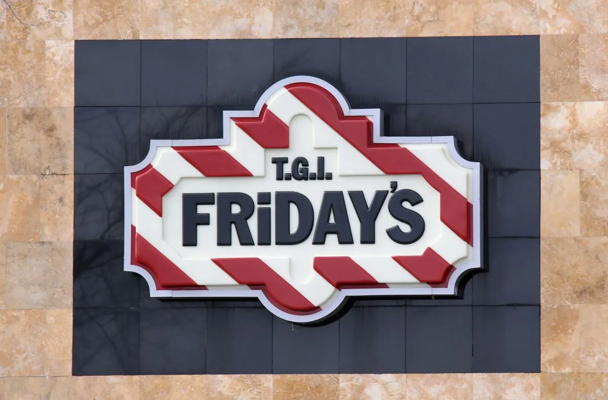 An image of TGI Fridays signage with red and white stripes