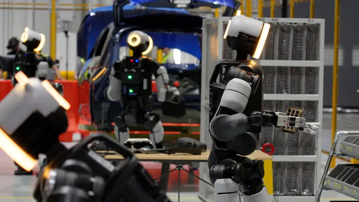 Boston Dynamics' Atlas humanoids conduct tasks at an automotive plant.