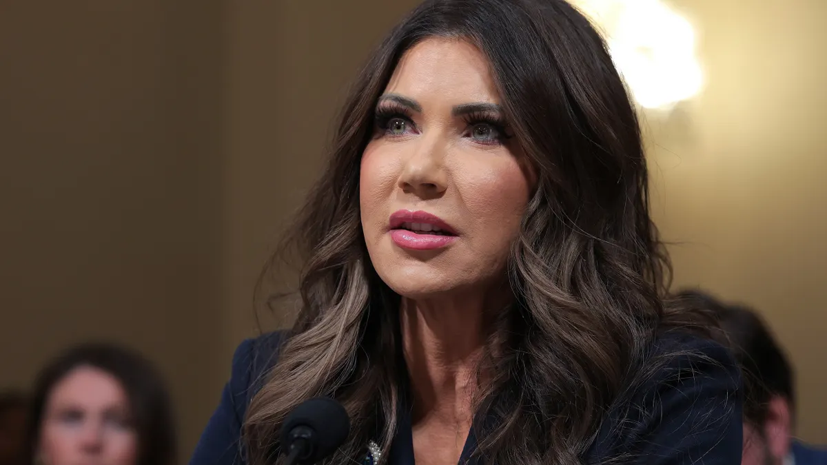 Close-up of a person with long brown hair.