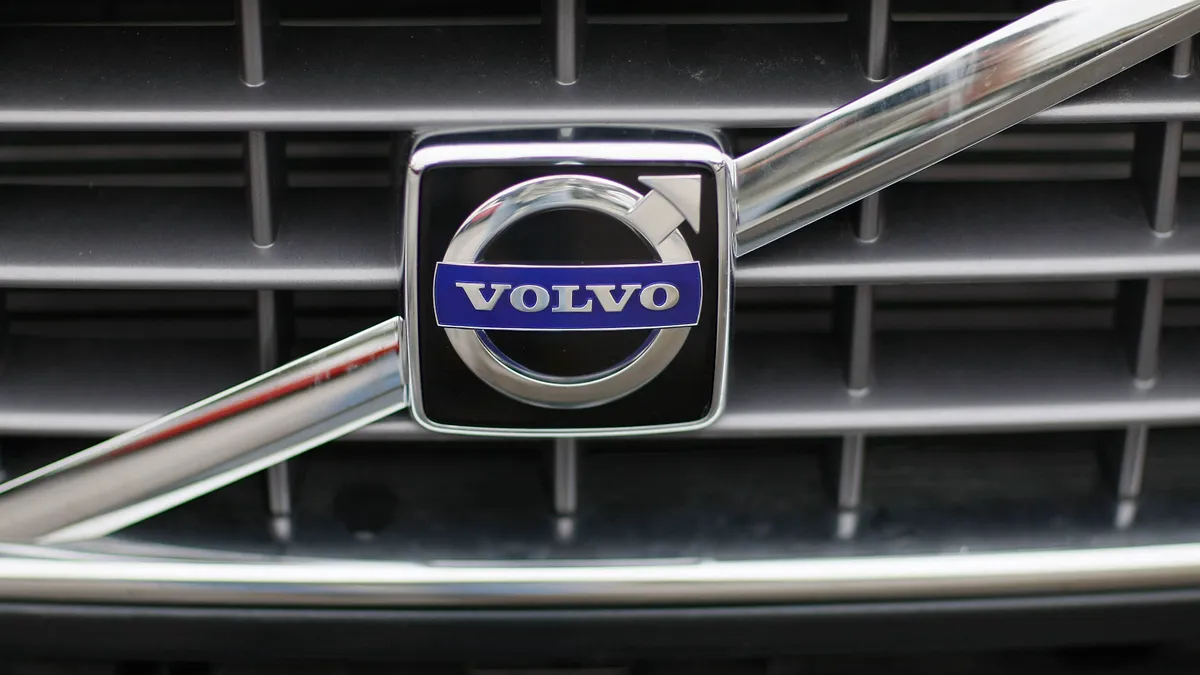 Close up of Volvo logo on car grill