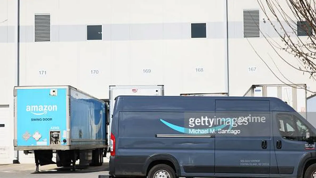 An Amazon delivery truck drives past Amazon's JFK8 Staten Island fulfillment center in Staten Island on March 25, 2022 in New York City.