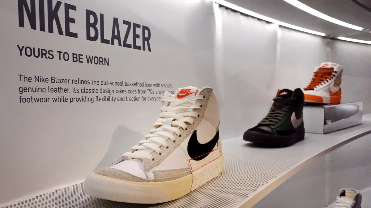 Nike shoes are seen on display in a store.