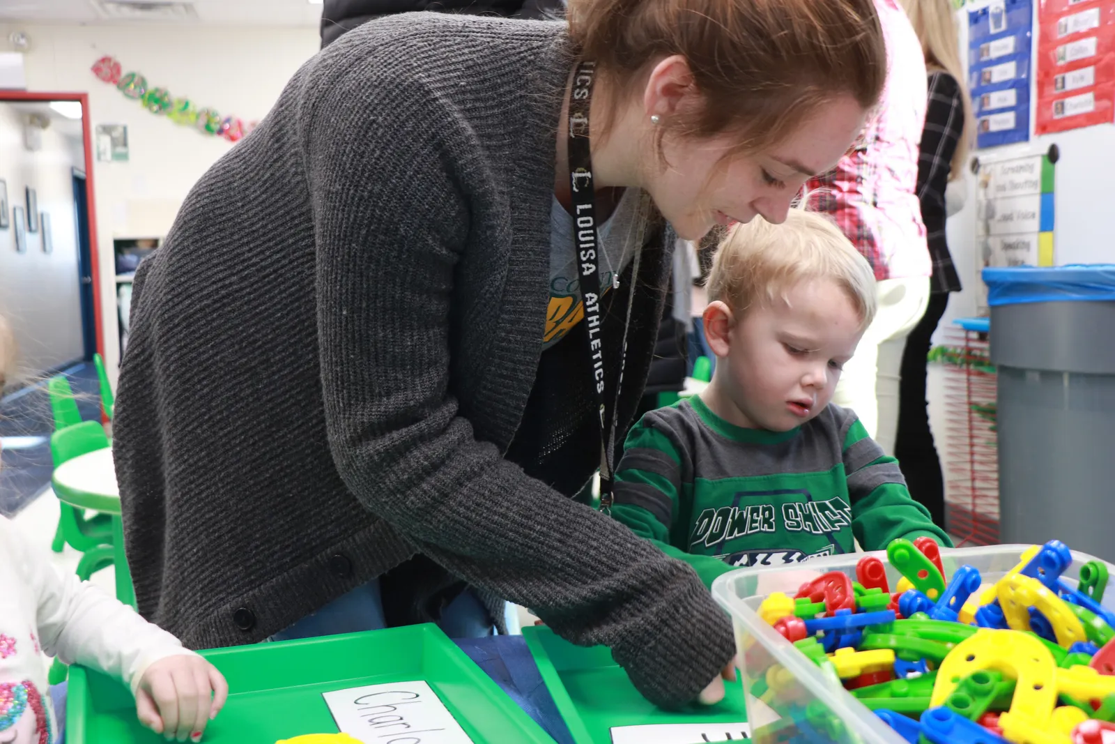 A high school student works with a child enrolled in the Little Lions Learning Lab.