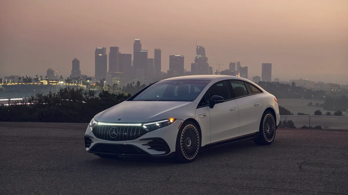 An all-electric Mercedes-AMG EQS 53 4MATIC+ parked.