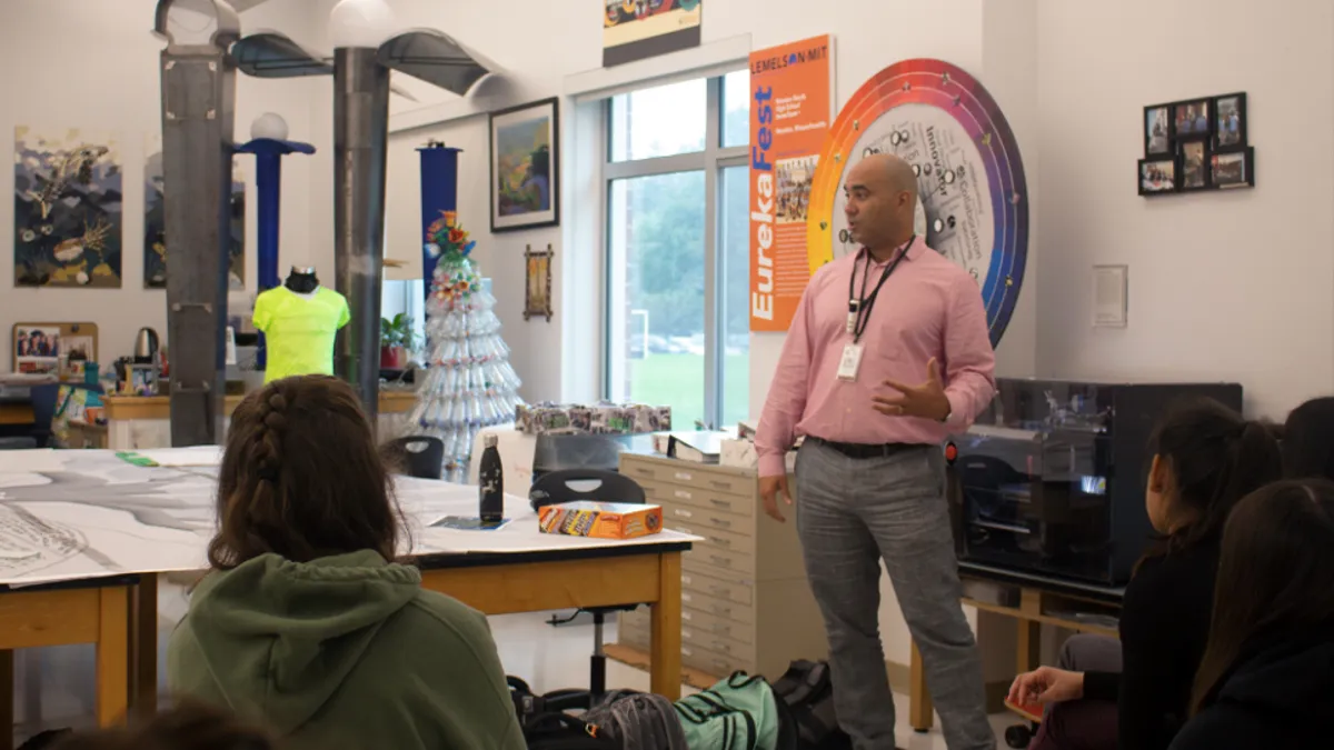 Principal Henry Turner leads a discussion at Newton North High School in Massachusetts.