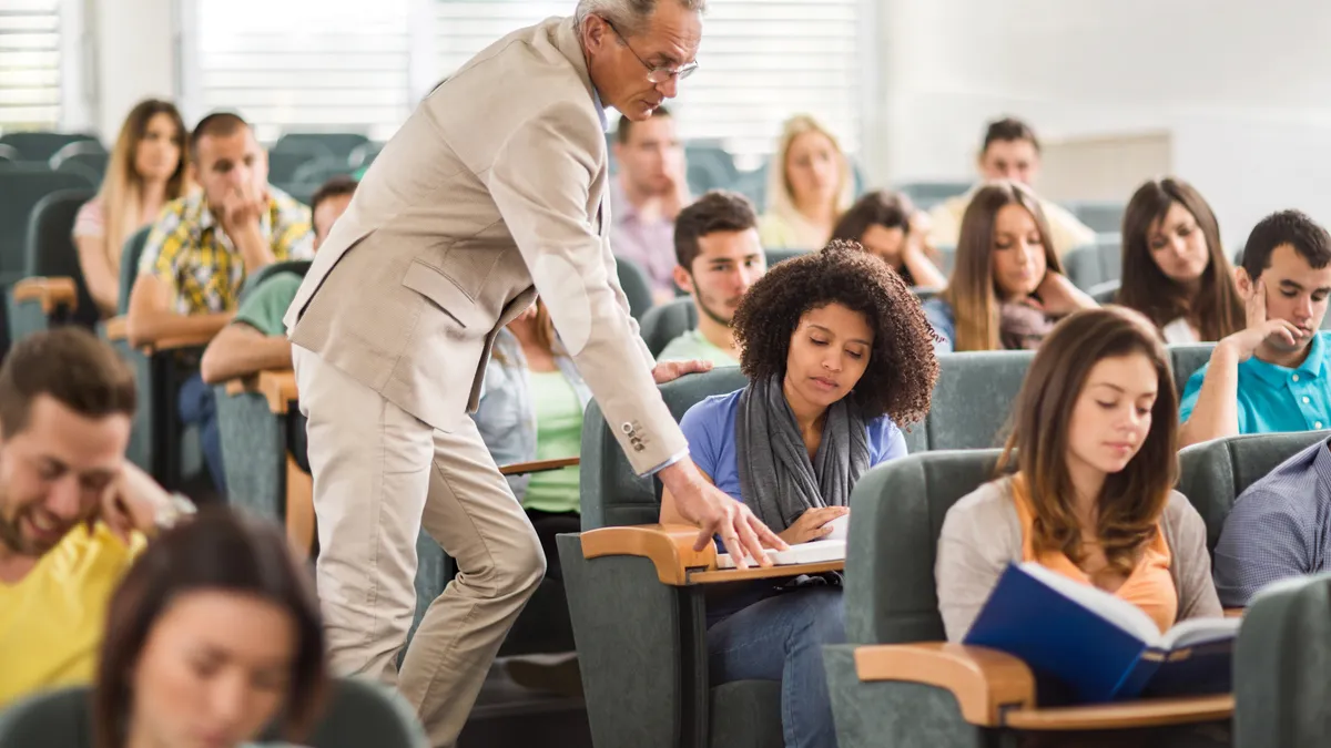 College student and professor in a classroom