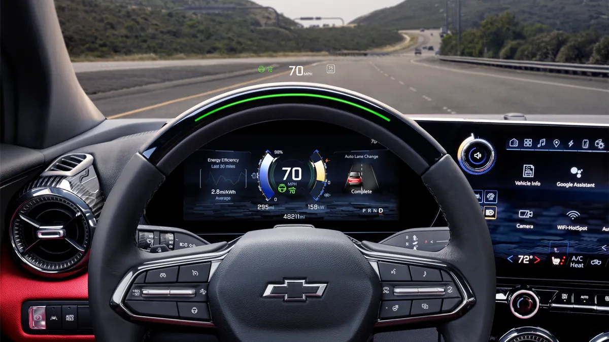 A close up view of the steering wheel and infotainment screen in the 2024 Chevrolet Blazer EV SS.