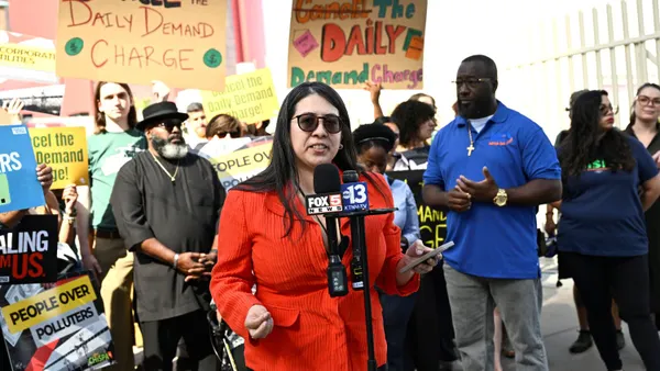 Progressive Leadership Alliance of Nevada climate equity policy fellow Leslie Vega speaks at a press conference hosted by utility customers and advocates outside the utility companies summit over rising electricity bills.
